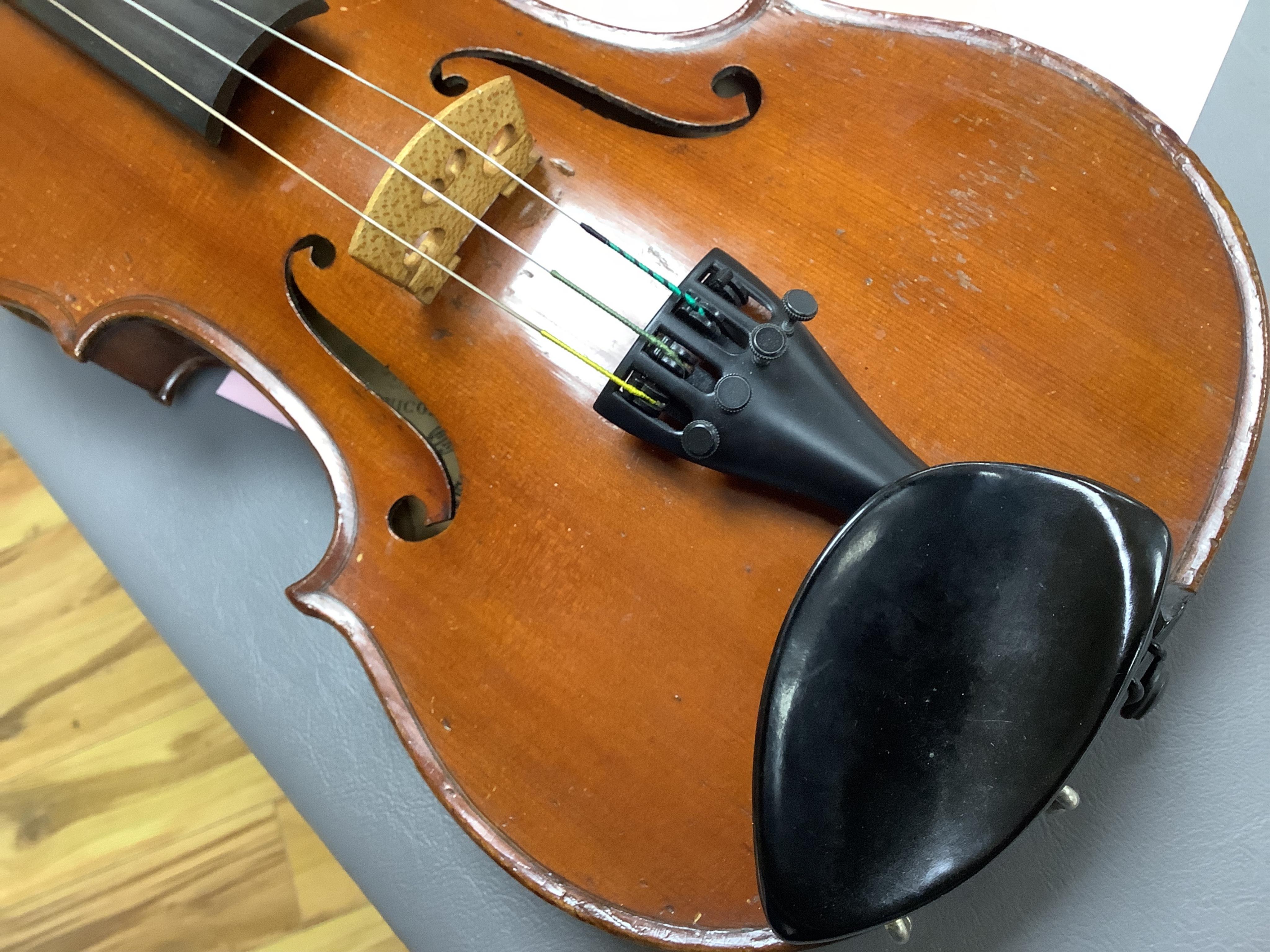 A cased late 19th century violin, signed ‘Nicolas Bertolini’, back 36.3cm, with bow stamped Paesold, CITES Submission reference, D9GSYMLJ